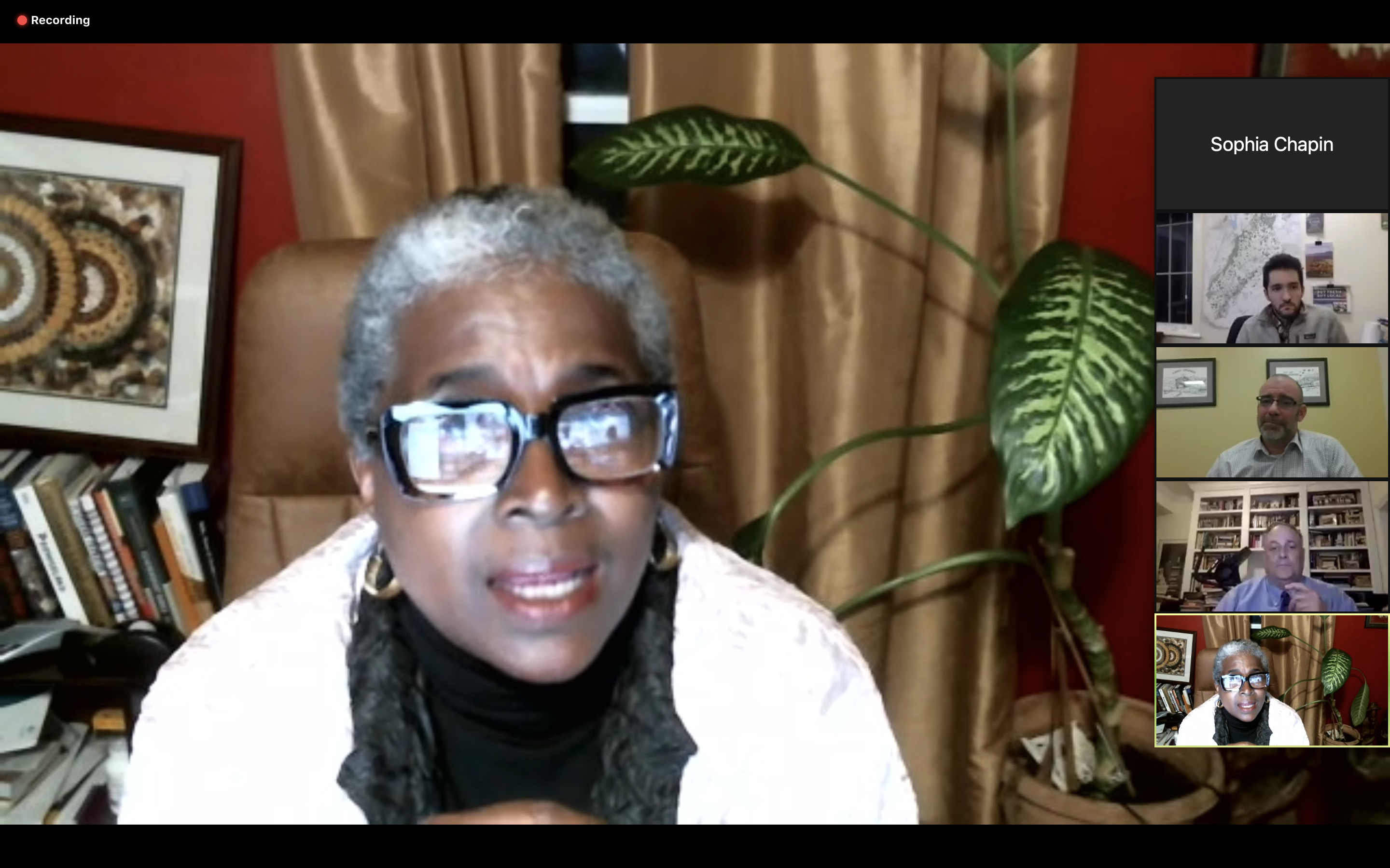 screenshot of a Zoom call, with a Black woman speaking in a home office